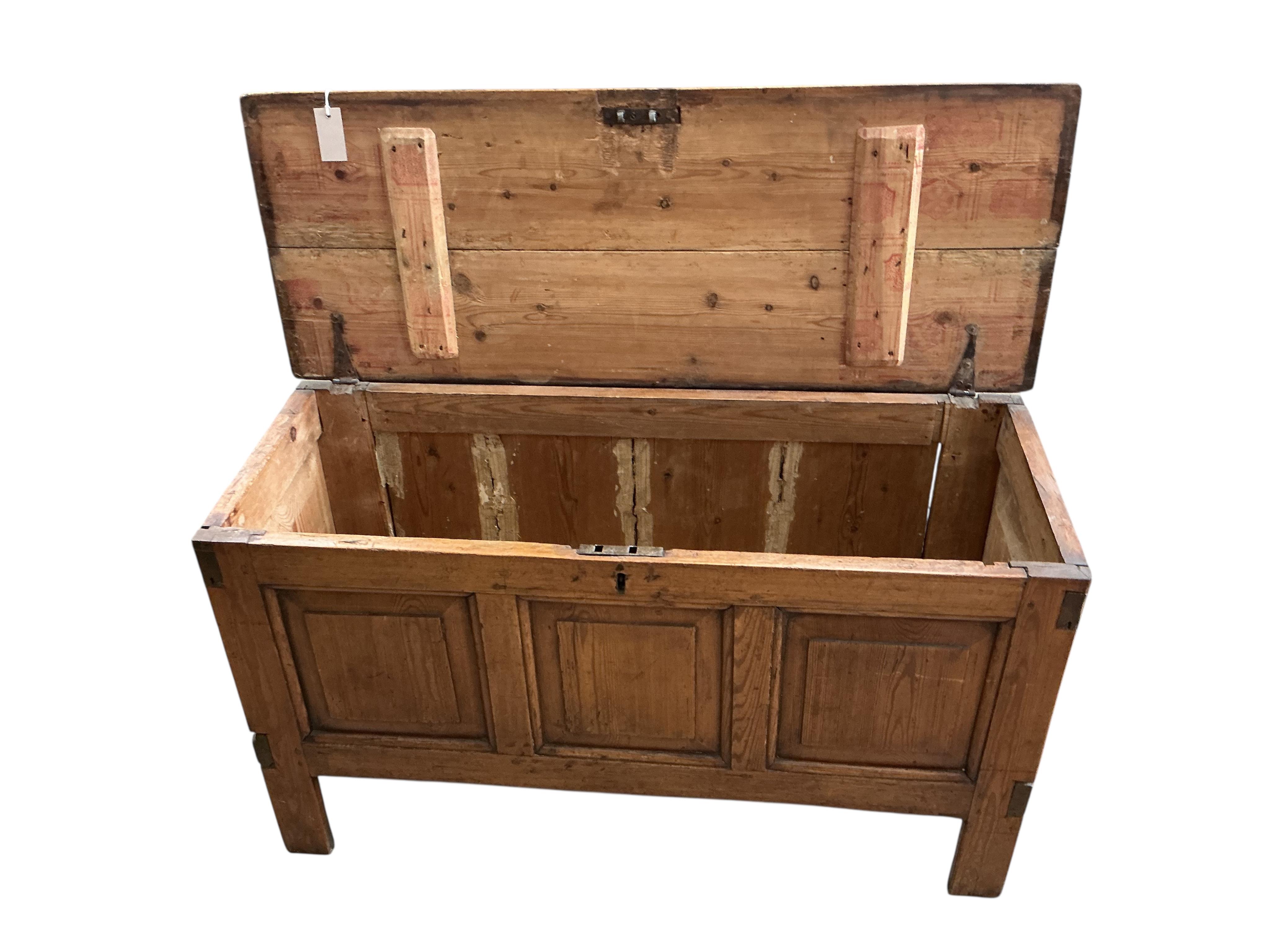 An 18th century panelled pine coffer, width 111cm, depth 42cm, height 62cm